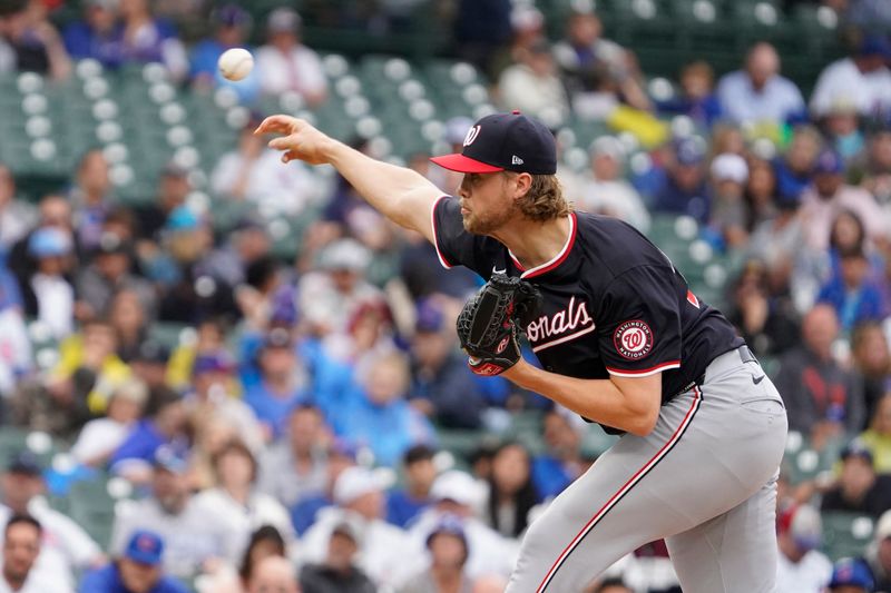 Sep 22, 2024; Chicago, Illinois, USA; Washington Nationals pitcher Jake Irvin (27) throws the ball against the Chicago Cubs during the first inning at Wrigley Field. Mandatory Credit: David Banks-Imagn Images