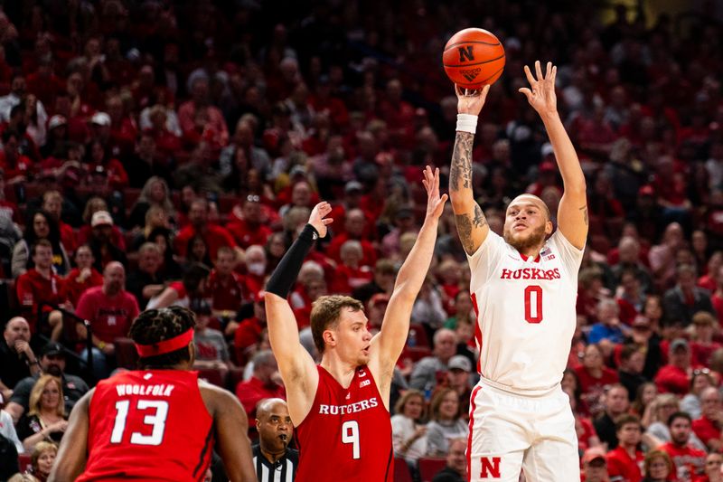 Mar 3, 2024; Lincoln, Nebraska, USA; Nebraska Cornhuskers guard C.J. Wilcher (0) shoots a 3-point shot against Rutgers Scarlet Knights forward Oskar Palmquist (9) at Pinnacle Bank Arena. Mandatory Credit: Dylan Widger-USA TODAY Sports