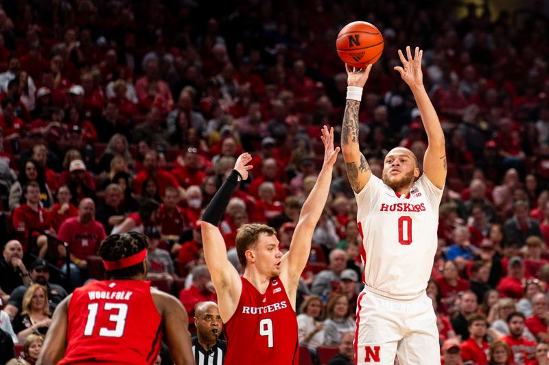 Mar 3, 2024; Lincoln, Nebraska, USA; Nebraska Cornhuskers guard C.J. Wilcher (0) shoots a 3-point shot against Rutgers Scarlet Knights forward Oskar Palmquist (9) at Pinnacle Bank Arena. Mandatory Credit: Dylan Widger-USA TODAY Sports