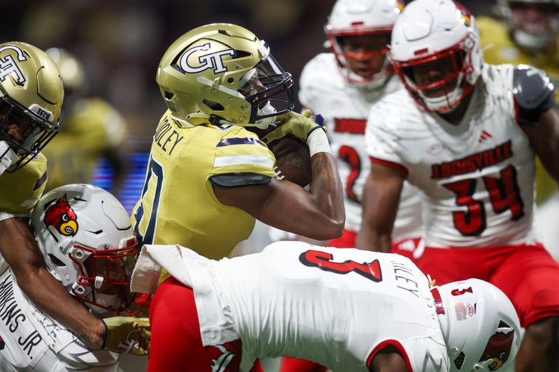 Sep 1, 2023; Atlanta, Georgia, USA; Georgia Tech Yellow Jackets running back Trey Cooley (0) scores a touchdown against the Louisville Cardinals in the second quarter at Mercedes-Benz Stadium. Mandatory Credit: Brett Davis-USA TODAY Sports