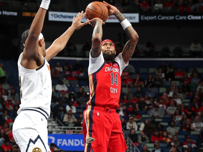 NEW ORLEANS, LA - NOVEMBER 15: Brandon Ingram #14 of the New Orleans Pelicans three point basket during the game against the Denver Nuggets during the Emirates NBA Cup game on November 15, 2024 at the Smoothie King Center in New Orleans, Louisiana. NOTE TO USER: User expressly acknowledges and agrees that, by downloading and or using this Photograph, user is consenting to the terms and conditions of the Getty Images License Agreement. Mandatory Copyright Notice: Copyright 2024 NBAE (Photo by Layne Murdoch Jr./NBAE via Getty Images)