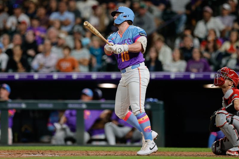 Sep 19, 2025; Denver, Colorado, USA; Colorado Rockies first baseman Blaine Crim (16) watches his ball on a sacrifice fly RBI in the fifth inning against the Los Angeles Angels at Coors Field. Mandatory Credit: Isaiah J. Downing-Imagn Images
