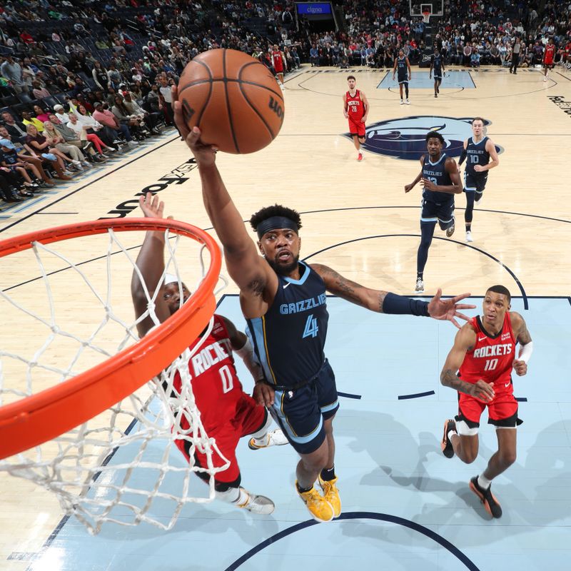 MEMPHIS, TN - FEBRUARY 14: Jordan Goodwin #4 of the Memphis Grizzlies drives to the basket during the game against the Houston Rockets on February 14, 2024 at FedExForum in Memphis, Tennessee. NOTE TO USER: User expressly acknowledges and agrees that, by downloading and or using this photograph, User is consenting to the terms and conditions of the Getty Images License Agreement. Mandatory Copyright Notice: Copyright 2024 NBAE (Photo by Joe Murphy/NBAE via Getty Images)