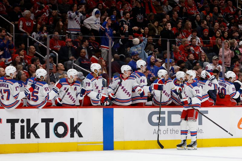Jan 4, 2025; Washington, District of Columbia, USA; New York Rangers center Filip Chytil (72) celebrates with teammates after scoring a goal against the Washington Capitals in the third period at Capital One Arena. Mandatory Credit: Geoff Burke-Imagn Images