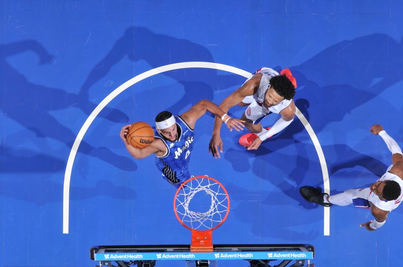 ORLANDO, FL - MARCH 3: Jalen Suggs #4 of the Orlando Magic drives to the basket during the game against the Detroit Pistons on March 3, 2024 at the Kia Center in Orlando, Florida. NOTE TO USER: User expressly acknowledges and agrees that, by downloading and or using this photograph, User is consenting to the terms and conditions of the Getty Images License Agreement. Mandatory Copyright Notice: Copyright 2024 NBAE (Photo by Fernando Medina/NBAE via Getty Images)