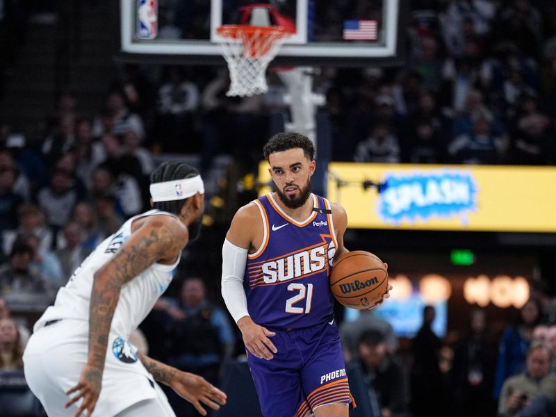 MINNEAPOLIS, MN -  NOVEMBER 17: Tyus Jones #21 of the Phoenix Suns dribbles the ball during the game against the Minnesota Timberwolves on November 17, 2024 at Target Center in Minneapolis, Minnesota. NOTE TO USER: User expressly acknowledges and agrees that, by downloading and or using this Photograph, user is consenting to the terms and conditions of the Getty Images License Agreement. Mandatory Copyright Notice: Copyright 2024 NBAE (Photo by Jordan Johnson/NBAE via Getty Images)