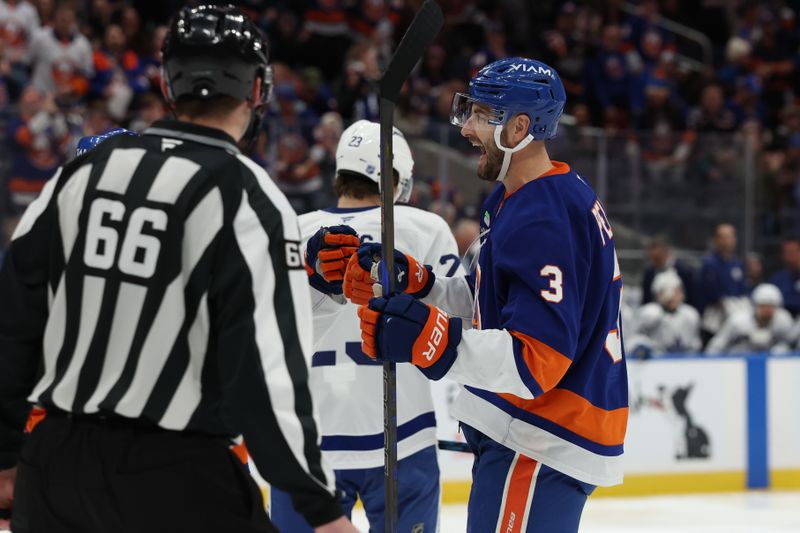 Jan 3, 2026; Elmont, New York, USA; New York Islanders defenseman Adam Pelech (3) celebrates after scoring a goal against the Toronto Maple Leafs during the second period at UBS Arena. Mandatory Credit: Thomas Salus-Imagn Images