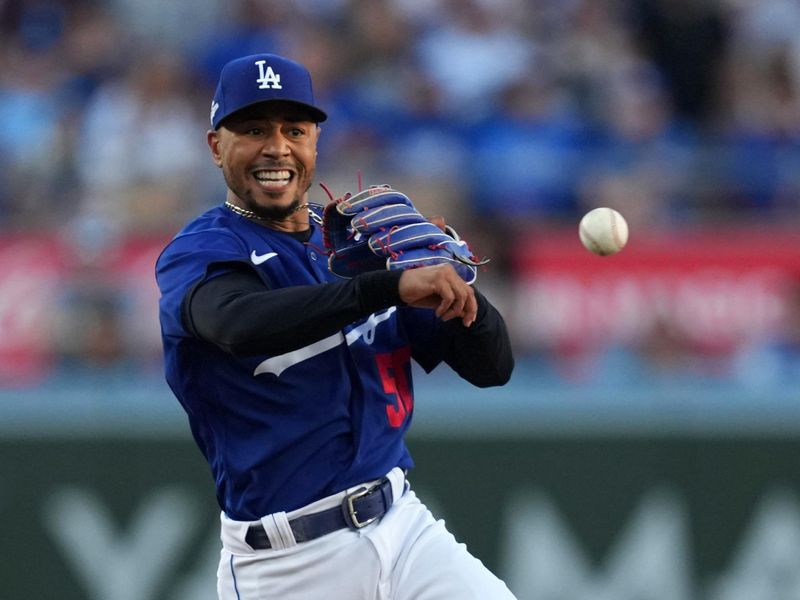 Jul 25, 2023; Los Angeles, California, USA; Los Angeles Dodgers second baseman Mookie Betts (50) throws to first base in the first inning against the Toronto Blue Jays at Dodger Stadium. Mandatory Credit: Kirby Lee-USA TODAY Sports