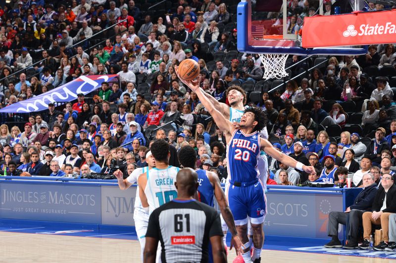 PHILADELPHIA, PA - NOVEMBER 10: Jared McCain #20 of the Philadelphia 76ers rebounds the ball during the game against the Charlotte Hornets on November 10, 2024 at the Wells Fargo Center in Philadelphia, Pennsylvania NOTE TO USER: User expressly acknowledges and agrees that, by downloading and/or using this Photograph, user is consenting to the terms and conditions of the Getty Images License Agreement. Mandatory Copyright Notice: Copyright 2024 NBAE (Photo by Jesse D. Garrabrant/NBAE via Getty Images)