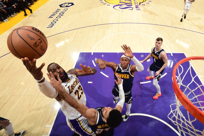 LOS ANGELES, CA - APRIL 27: LeBron James #23 of the Los Angeles Lakers drives to the basket during the game against the Denver Nuggets during Round 1 Game 4 of the 2024 NBA Playoffs on April 27, 2024 at Crypto.Com Arena in Los Angeles, California. NOTE TO USER: User expressly acknowledges and agrees that, by downloading and/or using this Photograph, user is consenting to the terms and conditions of the Getty Images License Agreement. Mandatory Copyright Notice: Copyright 2024 NBAE (Photo by Andrew D. Bernstein/NBAE via Getty Images)