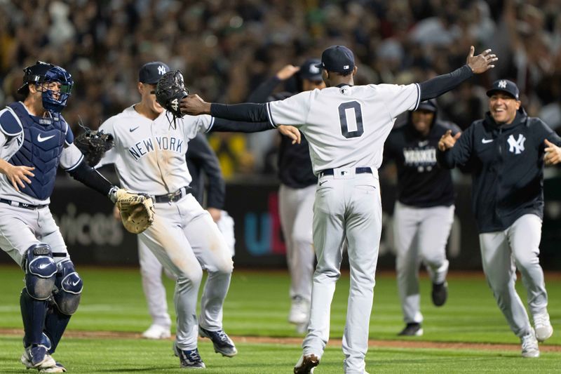 Jun 28, 2023; Oakland, California, USA;  New York Yankees starting pitcher Domingo German (0) celebrates with teammates after pitching a perfect game against the Oakland Athletics at Oakland-Alameda County Coliseum. It was the first perfect game in MLB since 2012 and the fourth perfect game in franchise history. Mandatory Credit: Stan Szeto-USA TODAY Sports