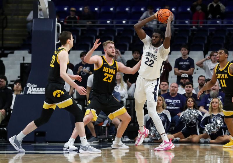 Feb 8, 2024; University Park, Pennsylvania, USA; Penn State Nittany Lions forward Qudus Wahab (22) looks to pass the ball as Iowa Hawkeyes forward Ben Krikke (23) defends during the second half at Bryce Jordan Center. Penn State defeated Iowa 89-79. Mandatory Credit: Matthew O'Haren-USA TODAY Sports