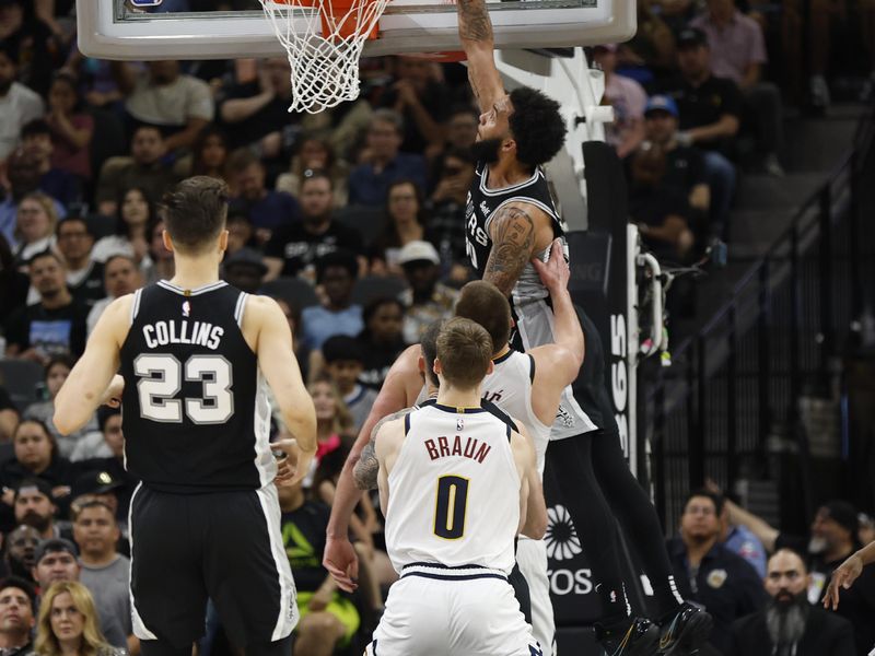 SAN ANTONIO, TX - APRIL 12: Julian Champagne #30 of the San Antonio Spurs scores a basket against the Denver Nuggets in the second half at Frost Bank Center on April 12, 2024 in San Antonio, Texas. NOTE TO USER: User expressly acknowledges and agrees that, by downloading and or using this photograph, User is consenting to terms and conditions of the Getty Images License Agreement. (Photo by Ronald Cortes/Getty Images)