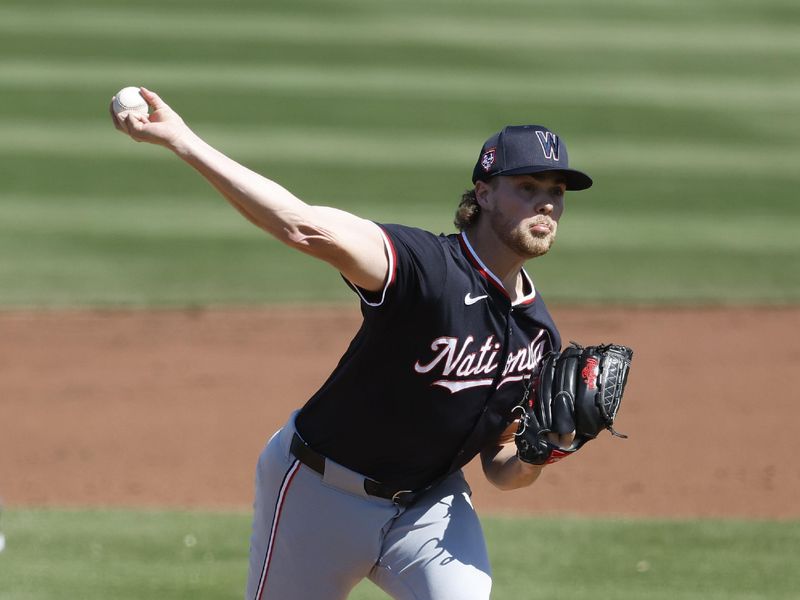 Feb 25, 2024; Jupiter, Florida, USA; Washington Nationals starting pitcher Jake Irvin (27) throws during the third inning at Roger Dean Chevrolet Stadium. Mandatory Credit: Rhona Wise-USA TODAY Sports