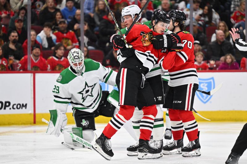 Jan 13, 2024; Chicago, Illinois, USA;  Dallas Stars defenseman Ryan Suter (20) pulls Chicago Blackhawks forward Lukas Reichel (27) away from his goaltender in the third period at United Center. Mandatory Credit: Jamie Sabau-USA TODAY Sports