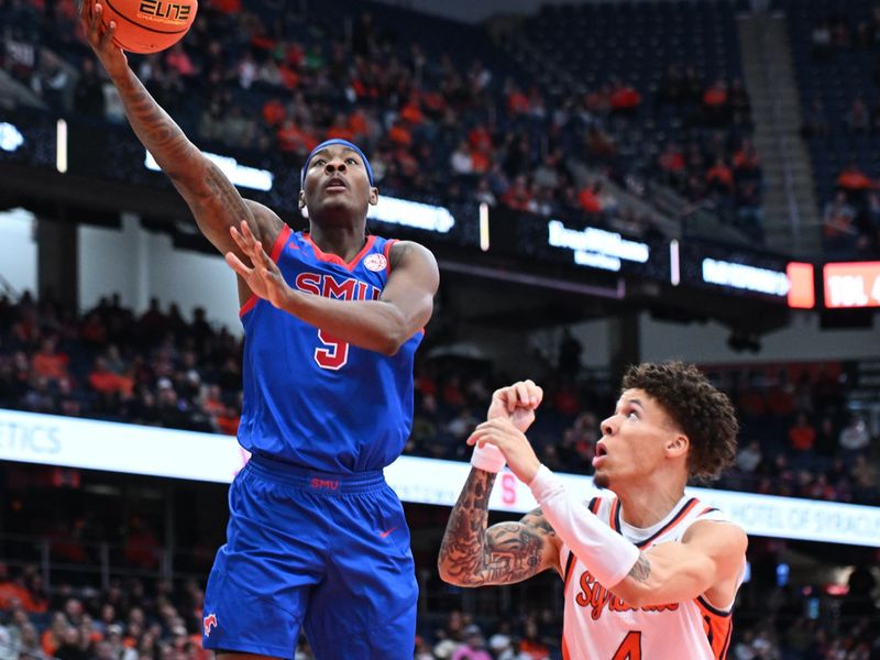 Feb 14, 2026; Syracuse, New York, USA; Southern Methodist University Mustangs guard Jaron Pierre Jr. (5) shoots the ball over Syracuse Orange guard Nate Kingz (4) in the first half at the JMA Wireless Dome. Mandatory Credit: Mark Konezny-Imagn Images