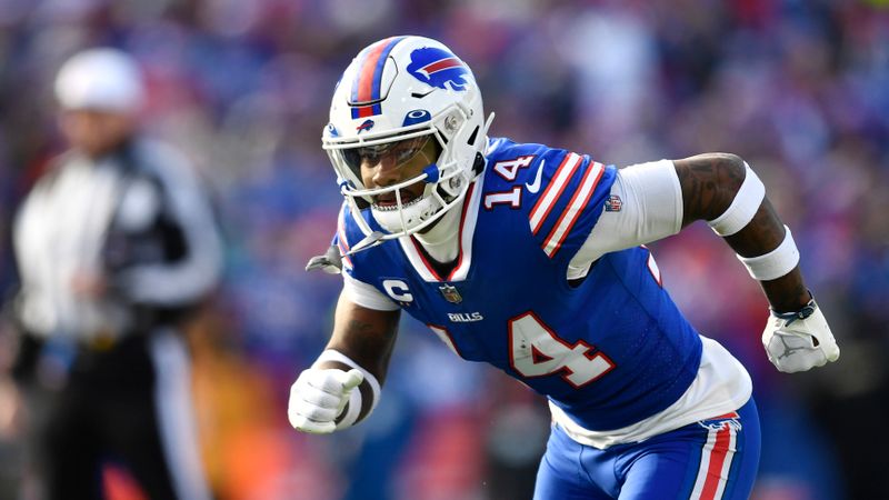 FILE - Buffalo Bills wide receiver Stefon Diggs (14) runs a route during the first half of an NFL wild-card playoff football game against the Miami Dolphins, Sunday, Jan. 15, 2023, in Orchard Park, N.Y. Bills star receiver Stefon Diggs is not present for the start of the team’s mandatory minicamp, coach Sean McDermott said before practice opened on Tuesday, June 13, 2023. “I’m very concerned,” is all McDermott would say regarding the absence of the team’s top receiving threat. (AP Photo/Adrian Kraus, File)