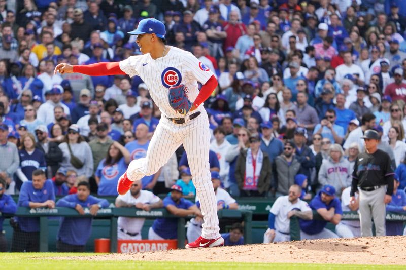 May 6, 2023; Chicago, Illinois, USA; Chicago Cubs relief pitcher Adbert Alzolay (73) throws against the Miami Marlins during the ninth inning at Wrigley Field. Mandatory Credit: David Banks-USA TODAY Sports