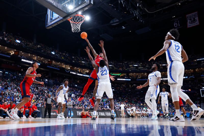 Mar 17, 2023; Columbus, OH, USA; Florida Atlantic Owls guard Alijah Martin (15) shoots the ball defended by Memphis Tigers forward Malcolm Dandridge (23) in the second half at Nationwide Arena. Mandatory Credit: Rick Osentoski-USA TODAY Sports