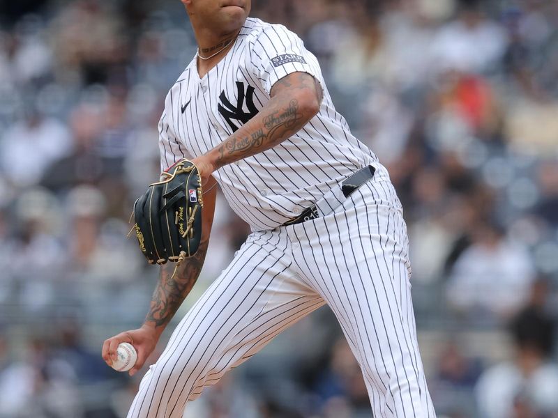 Apr 21, 2024; Bronx, New York, USA; New York Yankees starting pitcher Luis Gil (81) pitches against the Tampa Bay Rays during the first inning at Yankee Stadium. Mandatory Credit: Brad Penner-USA TODAY Sports