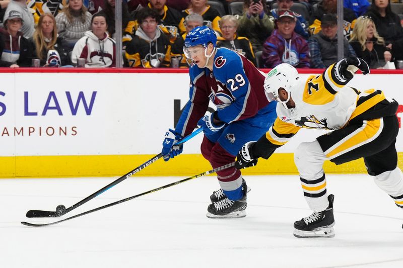 Mar 24, 2024; Denver, Colorado, USA; Pittsburgh Penguins defenseman Pierre-Olivier Joseph (73) defends on Colorado Avalanche center Nathan MacKinnon (29) in second period at Ball Arena. Mandatory Credit: Ron Chenoy-USA TODAY Sports