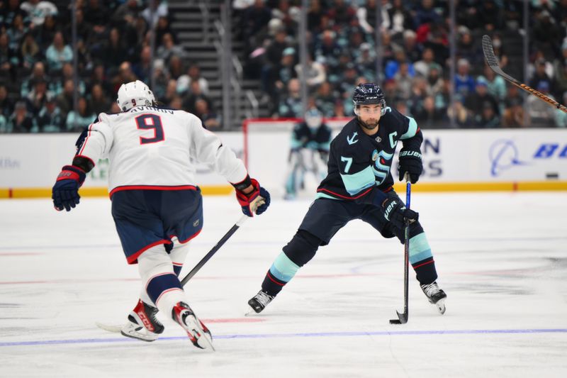 Nov 12, 2024; Seattle, Washington, USA; Seattle Kraken right wing Jordan Eberle (7) advances the puck against the Columbus Blue Jackets during the third period at Climate Pledge Arena. Mandatory Credit: Steven Bisig-Imagn Images