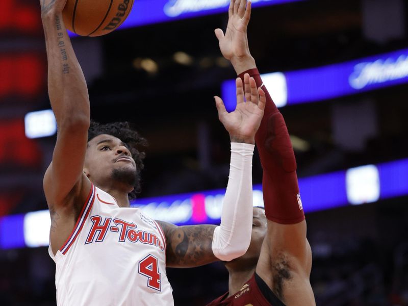 HOUSTON, TEXAS - MARCH 16: Jalen Green #4 of the Houston Rockets drives against Isaac Okoro #35 of the Cleveland Cavaliers during the second half at Toyota Center on March 16, 2024 in Houston, Texas. NOTE TO USER: User expressly acknowledges and agrees that, by downloading and or using this photograph, User is consenting to the terms and conditions of the Getty Images License Agreement. (Photo by Carmen Mandato/Getty Images)