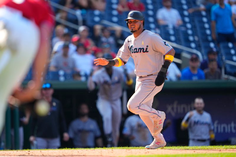 Sep 3, 2023; Washington, District of Columbia, USA; Miami Marlins second baseman Luis Arraez (3) scores a run on a Washington Nationals fielding error during the ninth inning at Nationals Park. Mandatory Credit: Gregory Fisher-USA TODAY Sports