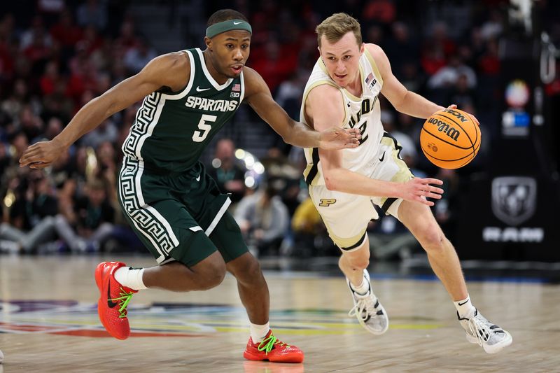 Mar 15, 2024; Minneapolis, MN, USA; Purdue Boilermakers guard Fletcher Loyer (2) works around Michigan State Spartans guard Tre Holloman (5) during the first half at Target Center. Mandatory Credit: Matt Krohn-USA TODAY Sports