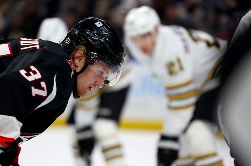 Dec 27, 2023; Buffalo, New York, USA;  Buffalo Sabres center Casey Mittelstadt (37) waits for the face-off during the second period against the Boston Bruins at KeyBank Center. Mandatory Credit: Timothy T. Ludwig-USA TODAY Sports