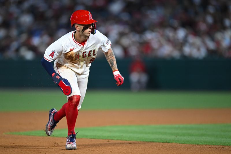 May 11, 2024; Anaheim, California, USA; Los Angeles Angels shortstop Zach Neto (9) runs to third base against the Kansas City Royals during the seventh inning at Angel Stadium. Mandatory Credit: Jonathan Hui-USA TODAY Sports