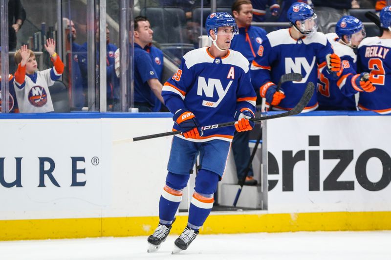 Feb 24, 2024; Elmont, New York, USA;  New York Islanders center Brock Nelson (29) circles back to center ice after scoring a goal in the third period against the Tampa Bay Lightning at UBS Arena. Mandatory Credit: Wendell Cruz-USA TODAY Sports