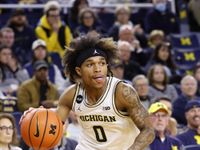 Wolverines' McDaniel Set to Shine Against Cornhuskers in Intense Clash