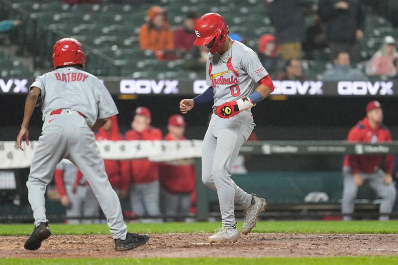May 28, 2025; Baltimore, Maryland, USA; St. Louis Cardinals shortstop Masyn Winn (0) scores a run on St. Louis Cardinals second baseman Brendan Donovan (33) (not pictured) two run home run against the Baltimore Orioles during the fifth inning at Oriole Park at Camden Yards. Mandatory Credit: Gregory Fisher-Imagn Images