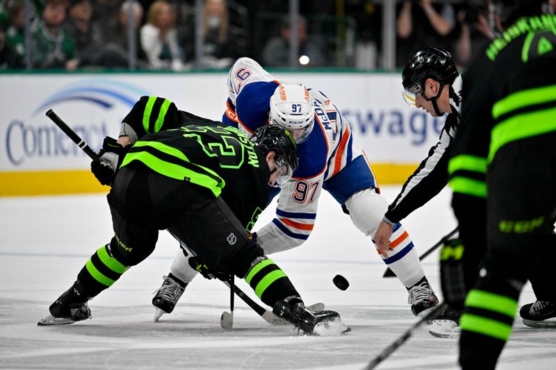 Apr 3, 2024; Dallas, Texas, USA; Dallas Stars center Wyatt Johnston (53) and Edmonton Oilers center Connor McDavid (97) take the face-off at center ice during the first period at the American Airlines Center. Mandatory Credit: Jerome Miron-USA TODAY Sports