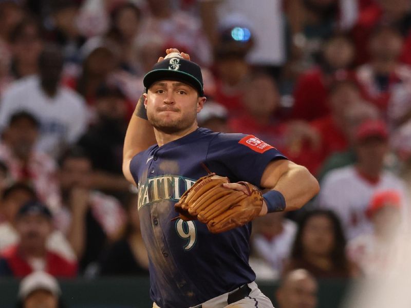 Jun 6, 2025; Anaheim, California, USA; Seattle Mariners third baseman Ben Williamson (9) throws to first for an out during the fourth inning against the Los Angeles Angels at Angel Stadium. Mandatory Credit: Jason Parkhurst-Imagn Images