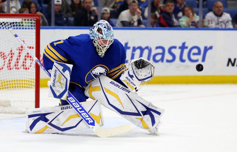 Nov 9, 2024; Buffalo, New York, USA;  Buffalo Sabres goaltender Ukko-Pekka Luukkonen (1) looks to make a save during the first period against the Calgary Flames at KeyBank Center. Mandatory Credit: Timothy T. Ludwig-Imagn Images