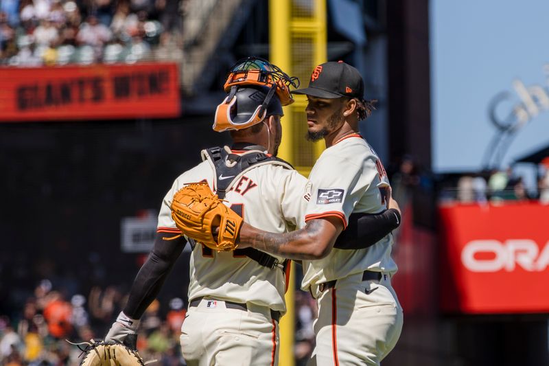 Apr 28, 2024; San Francisco, California, USA;  San Francisco Giants pitcher Camilo Doval (75) and catcher Patrick Bailey (14) celebrate their 3-2 win over the Pittsburgh Pirates at Oracle Park. Mandatory Credit: John Hefti-USA TODAY Sports