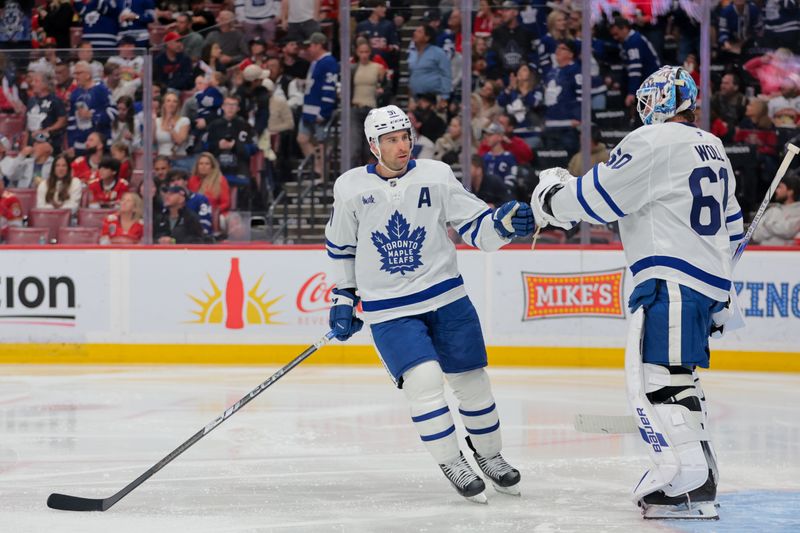 Apr 8, 2025; Sunrise, Florida, USA; Toronto Maple Leafs center John Tavares (91) celebrates with goaltender Joseph Woll (60) after scoring against the Florida Panthers during the second period at Amerant Bank Arena. Mandatory Credit: Sam Navarro-Imagn Images