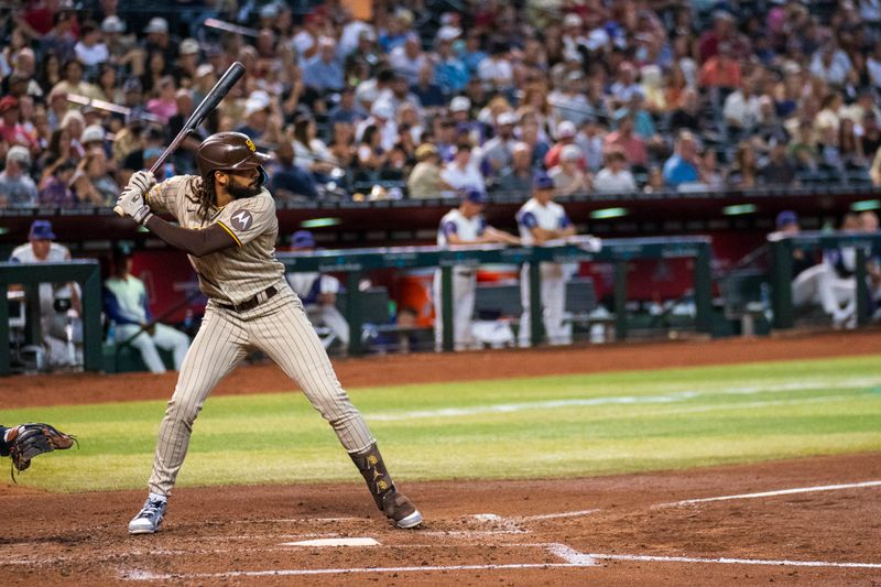 Aug 11, 2023; Phoenix, Arizona, USA; San Diego Padres outfielder Fernando Tatis Jr. (23) singles on a ground ball to center in the third inning against the Arizona Diamondbacks at Chase Field. Mandatory Credit: Allan Henry-USA TODAY Sports