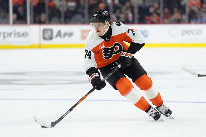 Oct 25, 2025; Philadelphia, Pennsylvania, USA; Philadelphia Flyers right wing Owen Tippett (74) controls the puck against the New York Islanders in overtime at Xfinity Mobile Arena. Mandatory Credit: Kyle Ross-Imagn Images