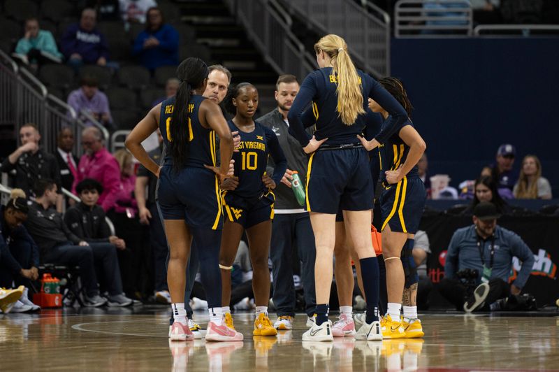 Mar 9, 2024; Kansas City, MO, USA; West Virginia Mountaineers players and coaches huddle during a time out during the second half against the Kansas State Wildcats at T-Mobile Center. Mandatory Credit: Amy Kontras-USA TODAY Sports