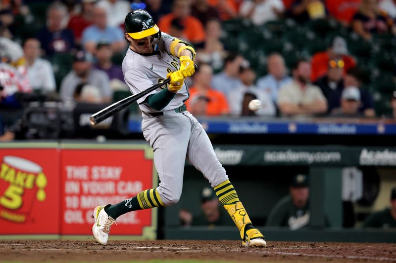 Sep 12, 2024; Houston, Texas, USA; Oakland Athletics shortstop Jacob Wilson (5) hits a double to center field against the Houston Astros during the seventh inning at Minute Maid Park. Mandatory Credit: Erik Williams-Imagn Images