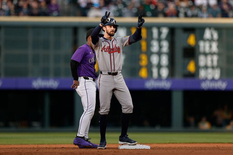 Apr 28, 2025; Denver, Colorado, USA; Atlanta Braves right fielder Eli White (36) reacts on second ahead of Colorado Rockies second baseman Adael Amador (1) after hitting a double in the third inning at Coors Field. Mandatory Credit: Isaiah J. Downing-Imagn Images