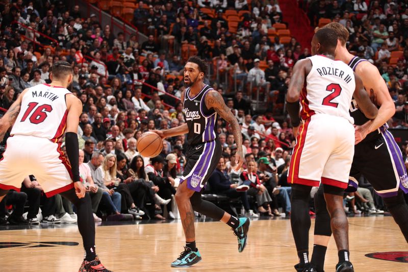 MIAMI, FL - JANUARY 31: Malik Monk #0 of the Sacramento Kings handles the ball during the game against the Miami Heat on January 31, 2024 at Kaseya Center in Miami, Florida. NOTE TO USER: User expressly acknowledges and agrees that, by downloading and or using this Photograph, user is consenting to the terms and conditions of the Getty Images License Agreement. Mandatory Copyright Notice: Copyright 2024 NBAE (Photo by Issac Baldizon/NBAE via Getty Images)