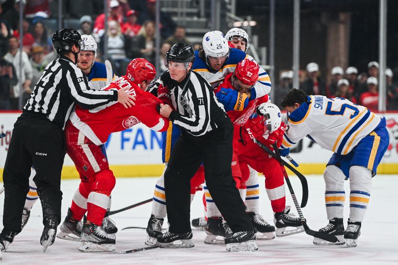 Apr 6, 2023; Detroit, Michigan, USA; Detroit Red Wings and Buffalo Sabres players fight as linesman Brad Kovachik (71) attempts to break it up during the first period at Little Caesars Arena. Mandatory Credit: Tim Fuller-USA TODAY Sports