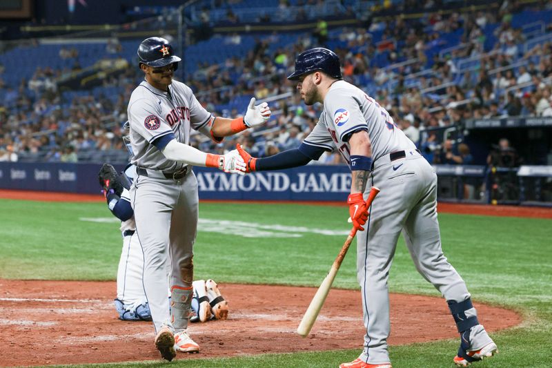 Aug 13, 2024; St. Petersburg, Florida, USA; Houston Astros shortstop Jeremy Pena (3) is congratulated by catcher Victor Caratini (17)) after hitting a home run against the Tampa Bay Rays in the sixth inning at Tropicana Field. Mandatory Credit: Nathan Ray Seebeck-USA TODAY Sports