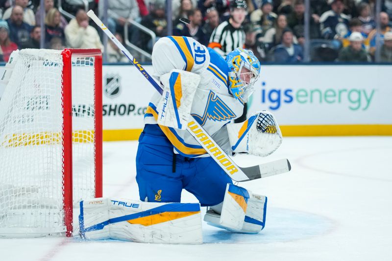 Nov 1, 2025; Columbus, Ohio, USA;  St. Louis Blues goaltender Joel Hofer (30) makes a save in net against the Columbus Blue Jackets in the second period at Nationwide Arena. Mandatory Credit: Aaron Doster-Imagn Images