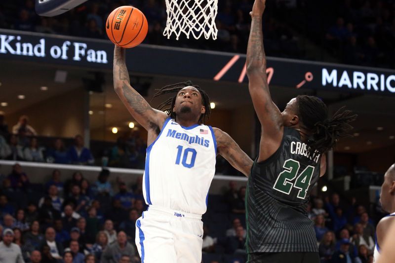 Feb 11, 2024; Memphis, Tennessee, USA; Memphis Tigers guard Jaykwon Walton (10) drives to the basket as Tulane Green Wave forward Kevin Cross (24) defends during the first half at FedExForum. Mandatory Credit: Petre Thomas-USA TODAY Sports