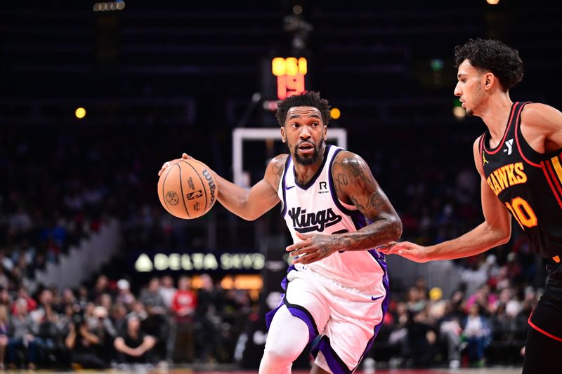 ATLANTA, GA - NOVEMBER 1: Malik Monk #0 of the Sacramento Kings handles the ball during the game against the Atlanta Hawks on November 1, 2024 at State Farm Arena in Atlanta, Georgia.  NOTE TO USER: User expressly acknowledges and agrees that, by downloading and/or using this Photograph, user is consenting to the terms and conditions of the Getty Images License Agreement. Mandatory Copyright Notice: Copyright 2024 NBAE (Photo by Adam Hagy/NBAE via Getty Images)